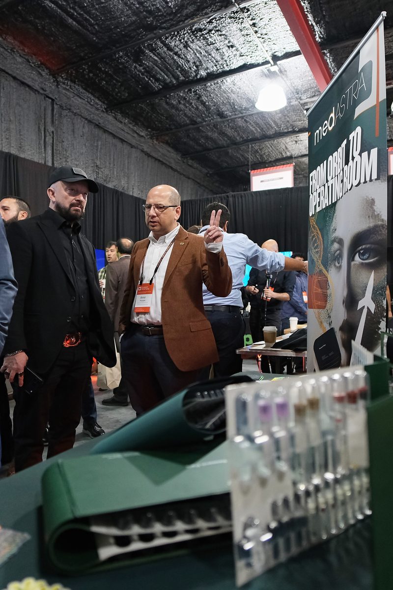 Amir Husain and Igor Tulchinsky at the MedAstra booth