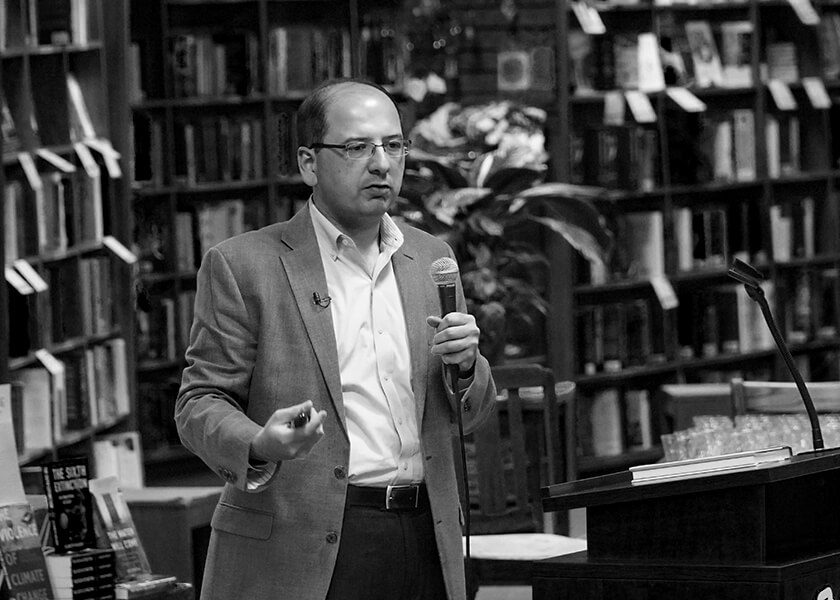 Amir Husain speaking in a library