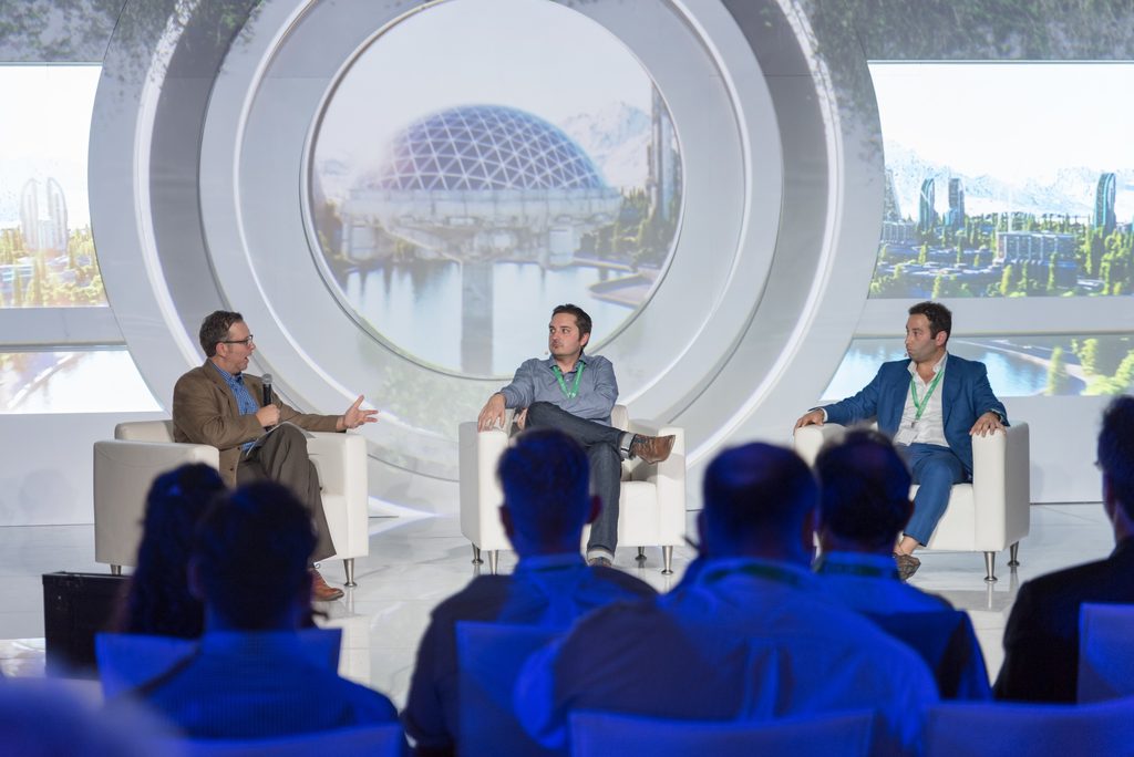 The portal behind the speakers was a mixed-media art piece combining a physical “star gate” like design with high-definition multi-media projections that adapted the view based on the discussion on-stage. The concept was based on being able to see into the future...